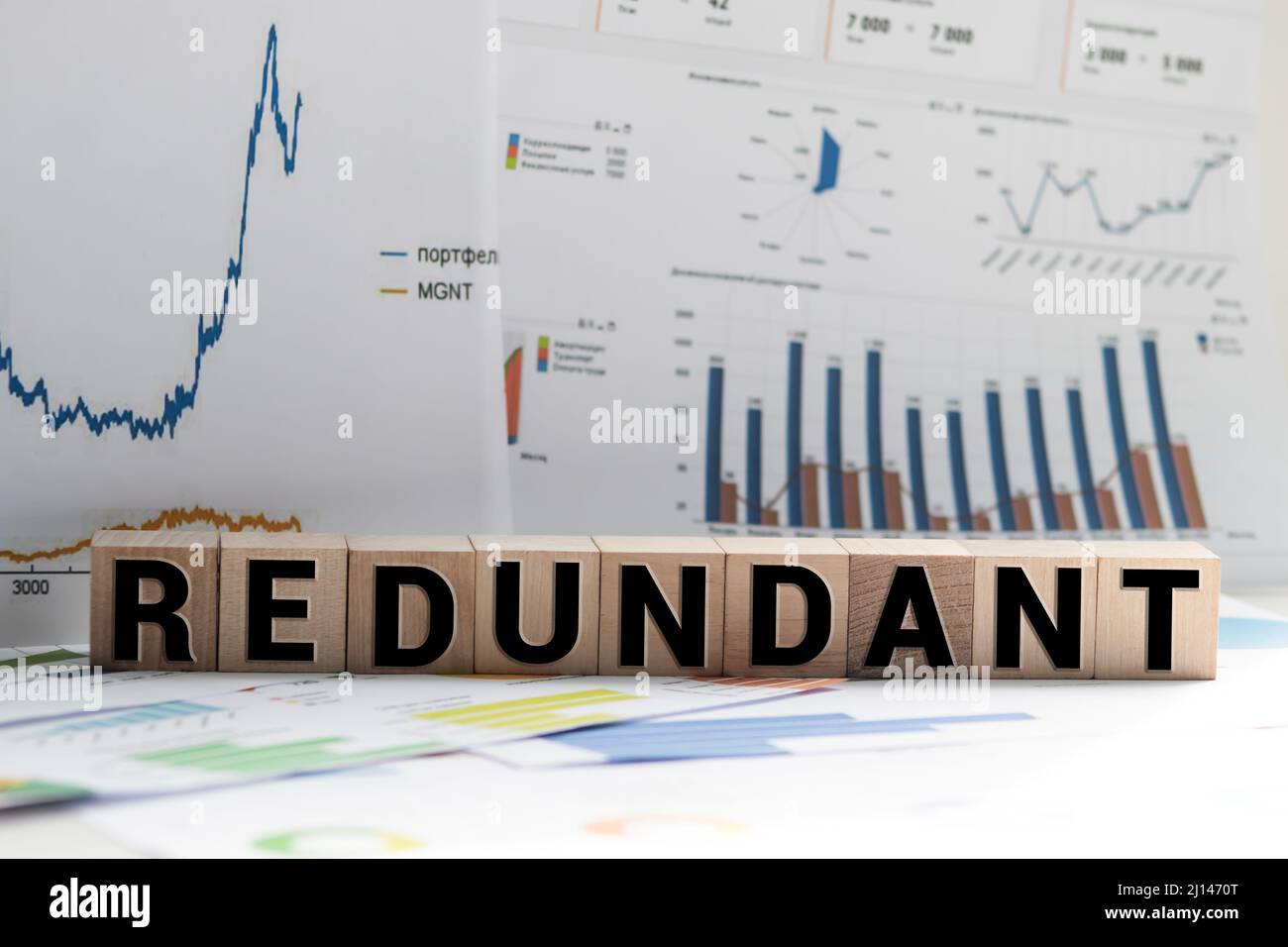 Redounding Text Redundand, sign written on wooden building blocks Stock Photo - Alamy