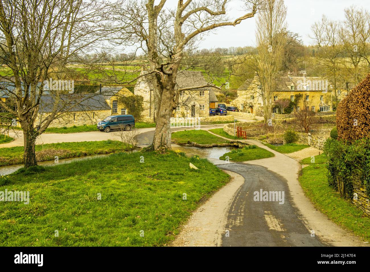 Looking down in Upper Slaughter at the ford infront of the houses  - the ford is the River Eye Stock Photo