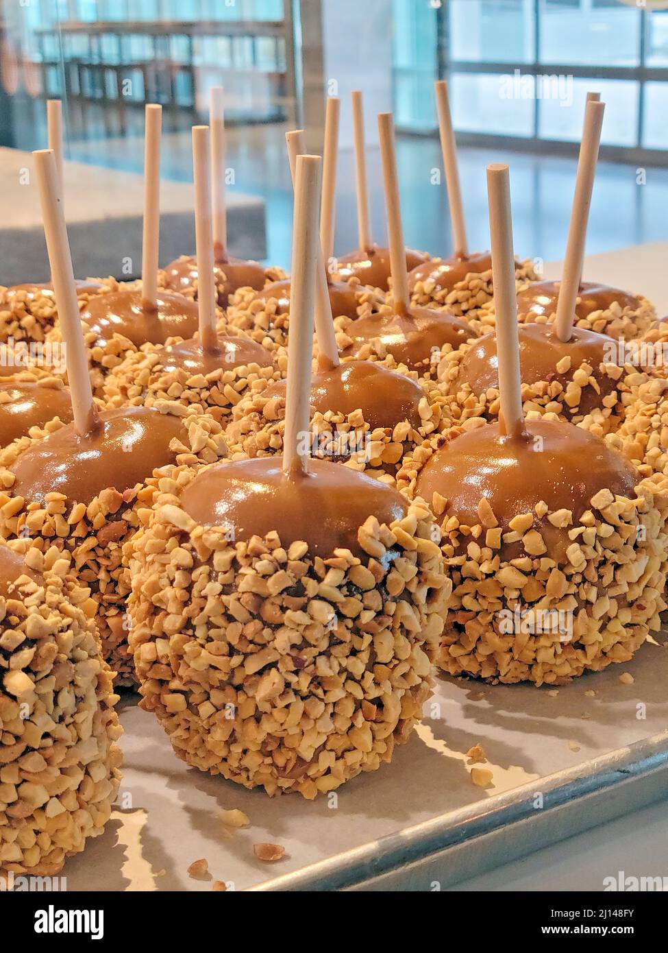 Close up of caramel apples on a stick with nuts Stock Photo