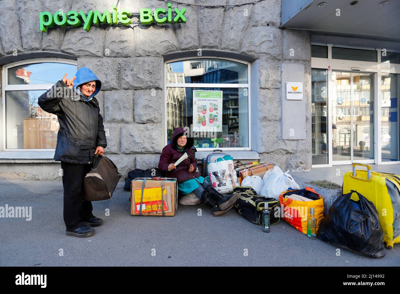 Kyiv, Ukraine. 22nd Mar, 2022. Homeless Irla (L), 35, and her 62 year-old companion are surrounded by belongings on the street, during the newly imposed 35-hour curfew, amid the Russian invasion. They say they have nowhere to go to apart from getting into shelters in the event of air raid sirens. (Credit Image: © Daniel Ceng Shou-Yi/ZUMA Press Wire) Credit: ZUMA Press, Inc./Alamy Live News Stock Photo