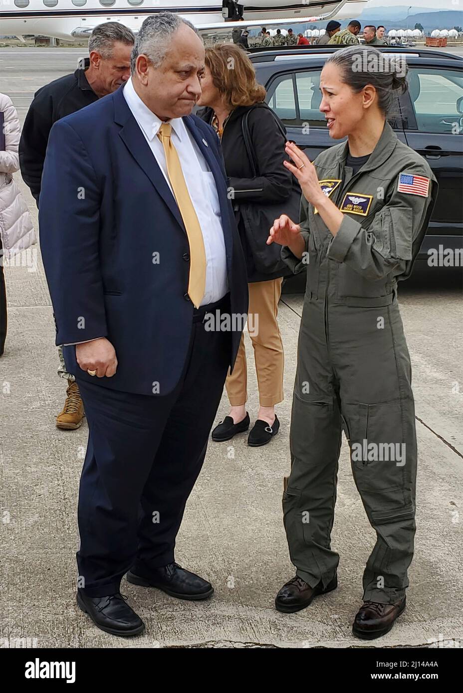 Sigonella, Italy. 21 March, 2022. U.S. Secretary of the Navy Carlos Del Toro, left, speaks with Command Master Chief Anna Wood, on arrival to NAS Sigonella, March 21, 2022 in the Sigonella, Italy.  Credit: MC1 Kegan Kay/US Navy/Alamy Live News Stock Photo
