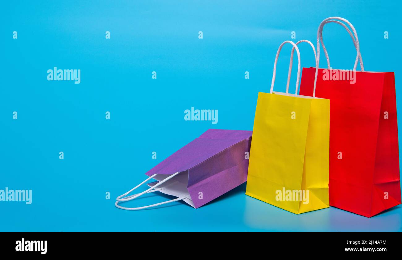 several paper bags on a blue background Stock Photo