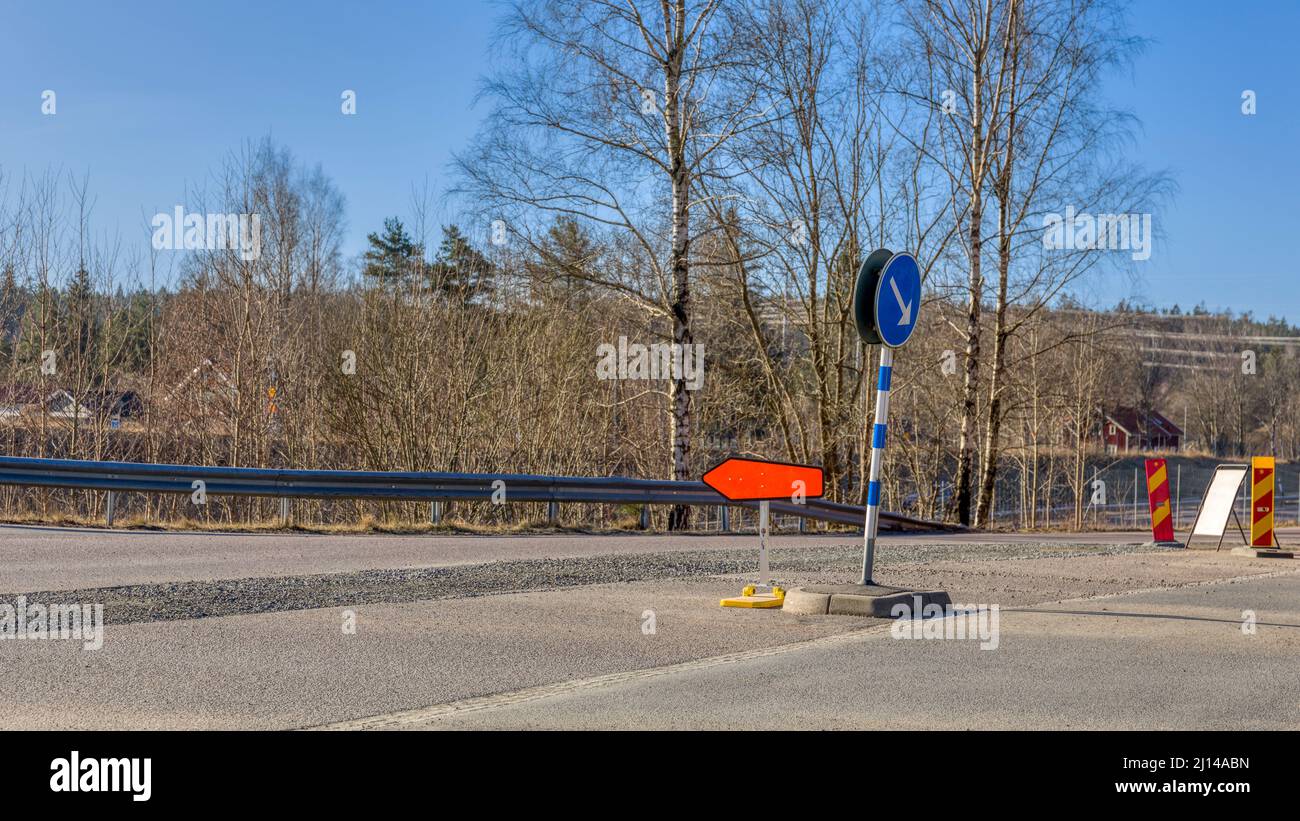 Road intersection with detour sign Stock Photo