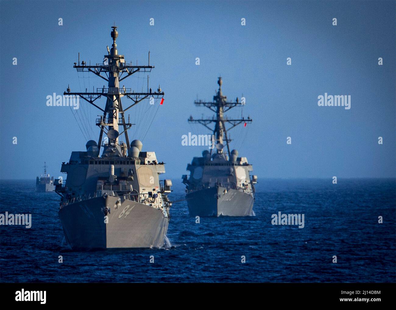 Atlantic Ocean, United States. 23 February, 2022. The U.S. Navy Arleigh-burke class guided-missile destroyers USS Bulkeley, left, and the USS Truxton sail in formation during a Surface Warfare Advanced Tactical Training live-fire exercise, February 23, 2022 in the Atlantic Ocean.  Credit: MC3 Bryan Valek/Planetpix/Alamy Live News Stock Photo