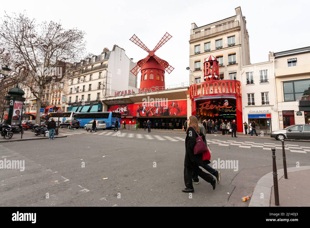 Paris, France - 21 February, 2010: Cabaret Moulin Rouge with red mill in Paris district Montmartre. Stock Photo