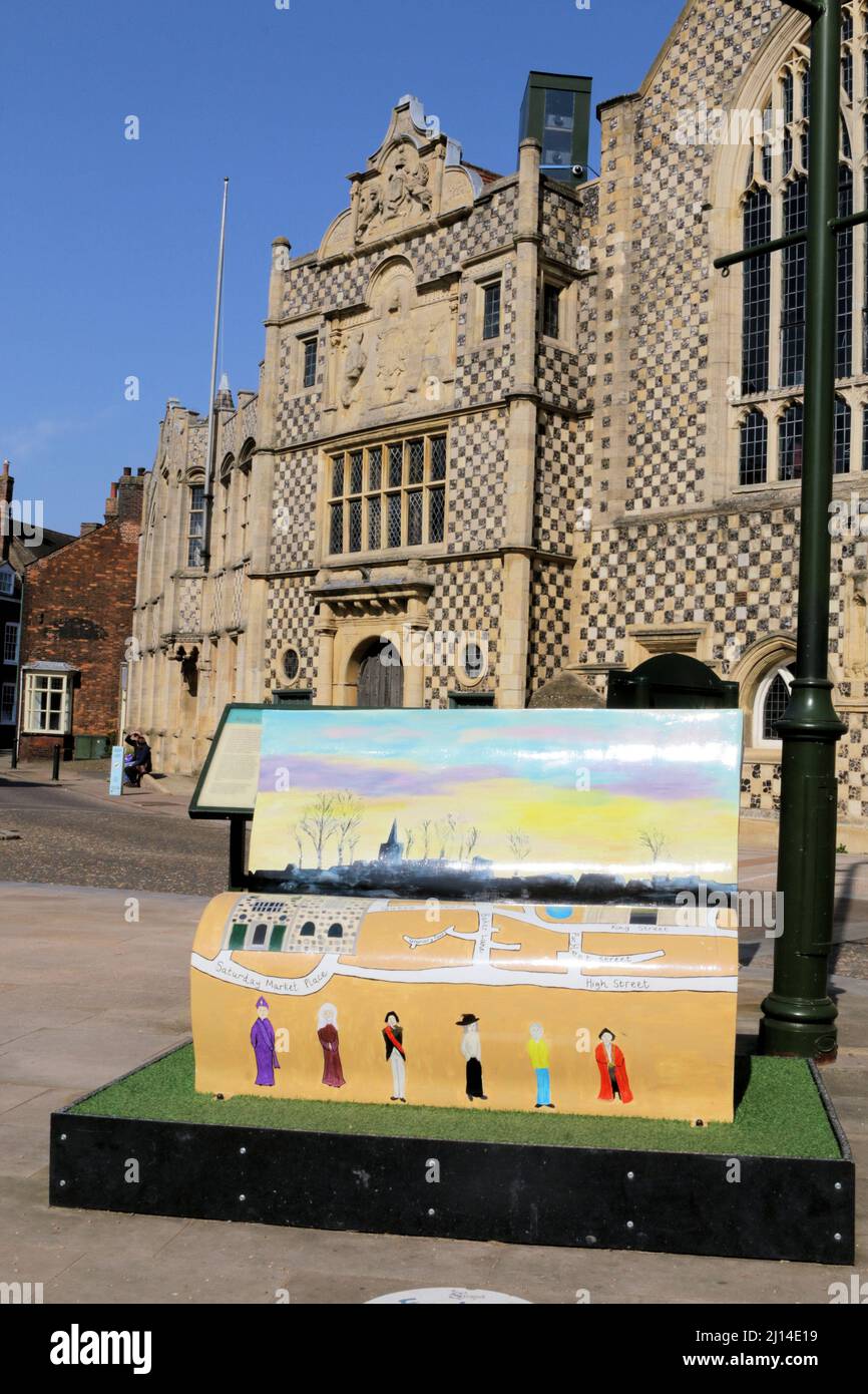 One of seven Explore-a-book benches in West Norfolk. This is in front of King's Lynn's 15th century Guild and Town Halls Stock Photo