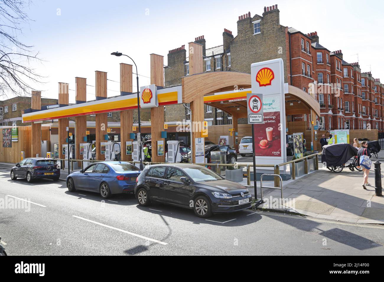 Oil company Shell's new Recharge Station on Fulham Road, west London, UK. The busy garage forecourt provides only electric charging. Stock Photo