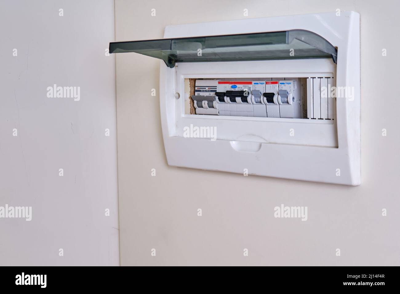 Automatic fusein a home electrical panel in the closet with clothes. Electricity equipment in