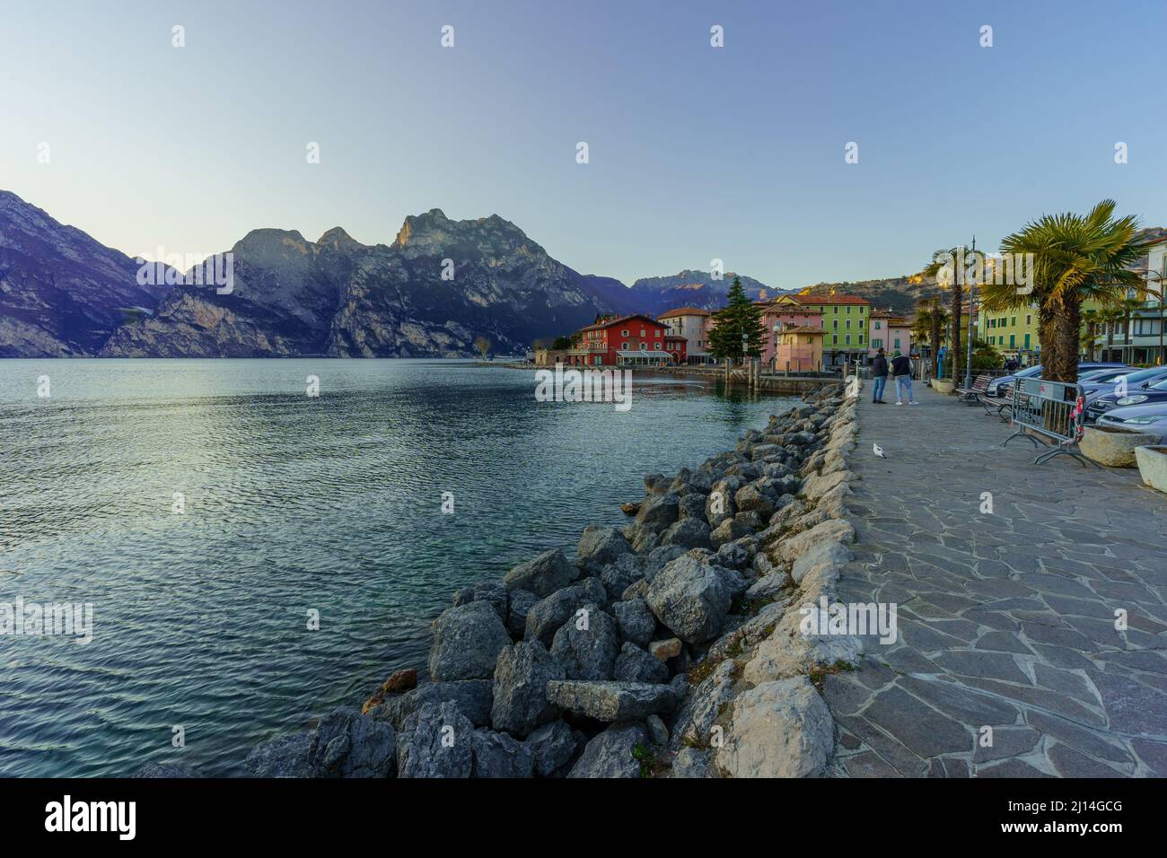 Nago–Torbole, Italy - February 26, 2022: View of the north shore of Lake  Garda, with locals and visitors, on a clear winter day, in Nago–Torbole,  Tren Stock Photo - Alamy
