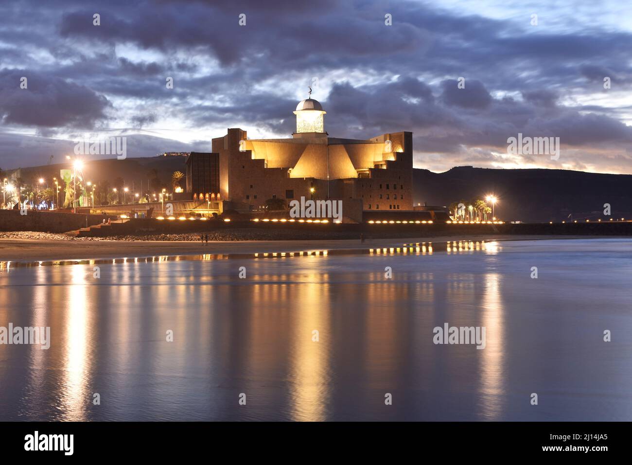 Auditorio Alfredo Kraus, modern architecture illuminated at dusk, located at the end of Las Canteras beach in Las Palmas of Gran Canaria Spain. Stock Photo