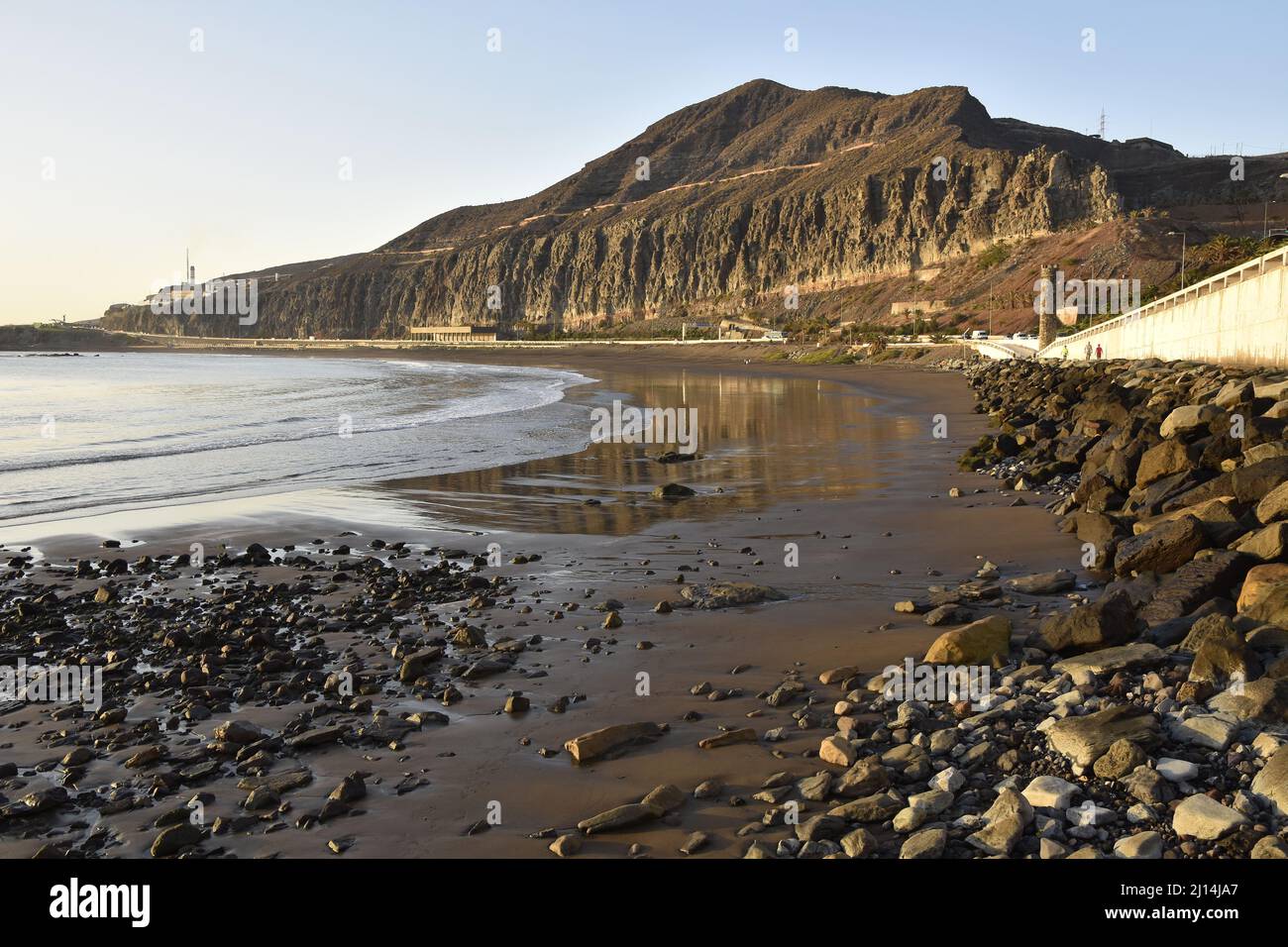 Rocky Playa de la Laja beach with dark volcanic sand located near Las Palmas in Gran Canaria Canary Islands Spain. Stock Photo