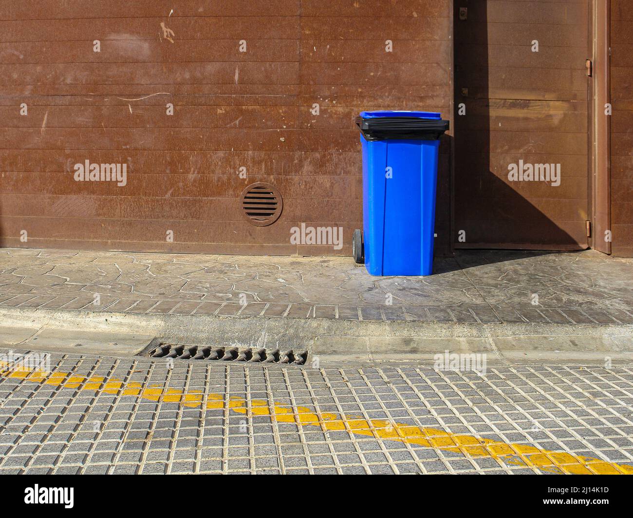 Garbage container in the street Stock Photo