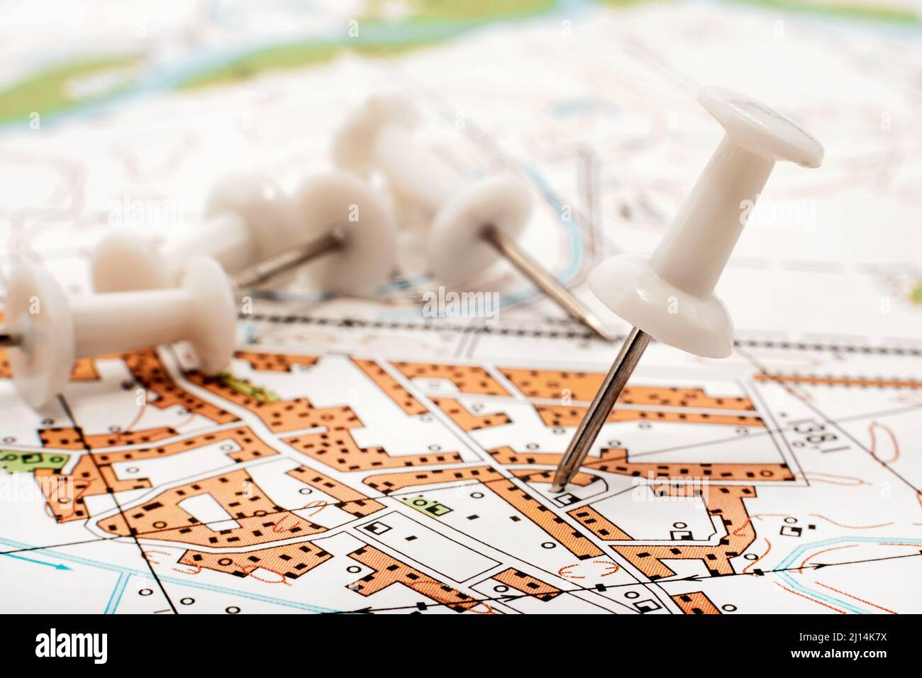 A paper clip on the map shows the end point of the route. Travel guide. Map of the city, area Stock Photo