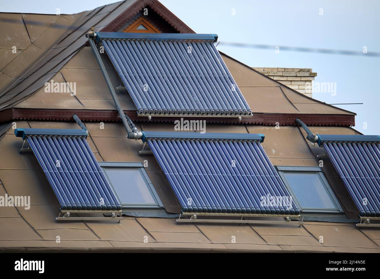 Building roof with rows of vacuum air solar collectors for water ...
