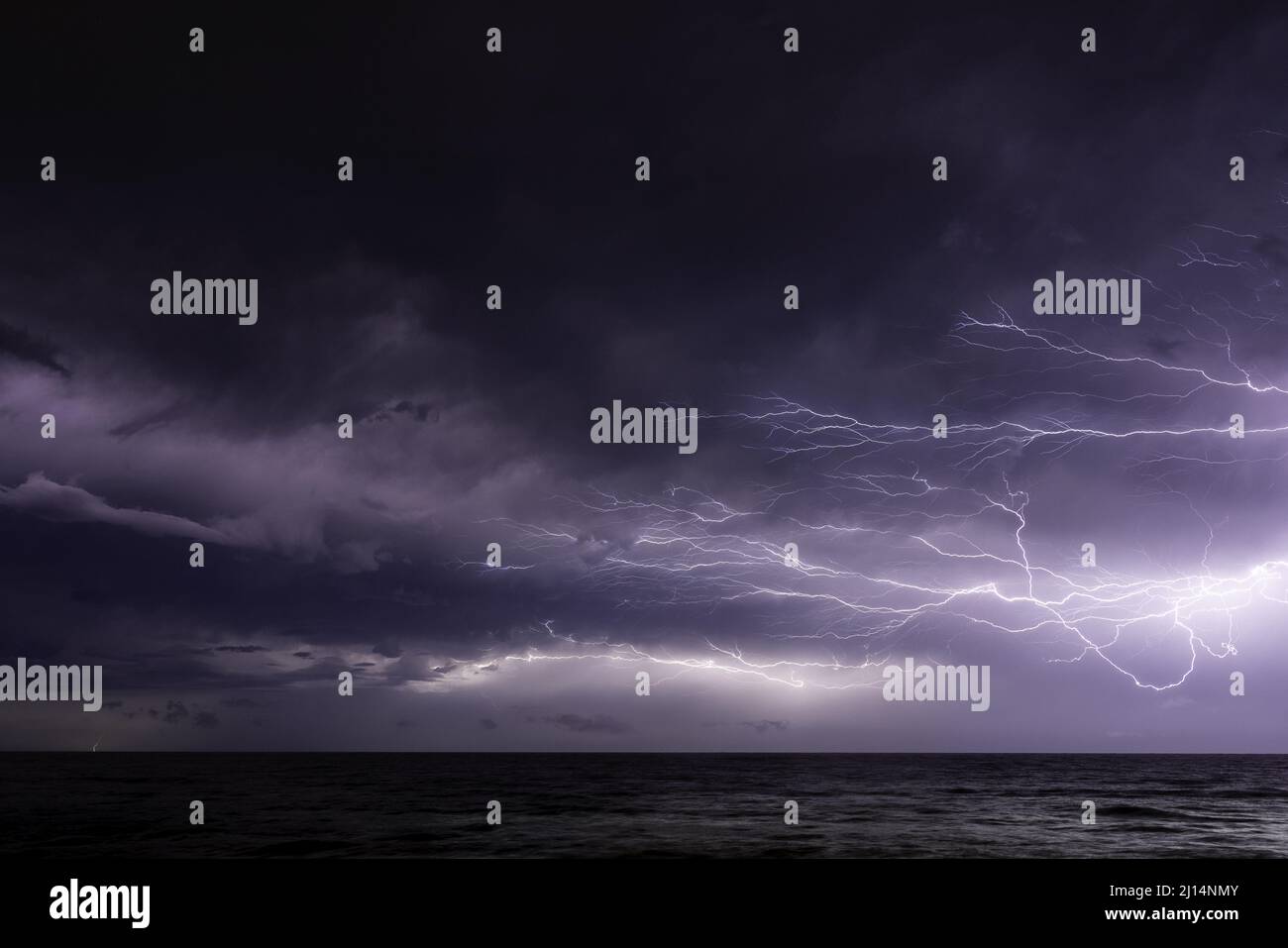 Dramatic purple sunset sky with thunderstorm and lightning Stock Photo ...