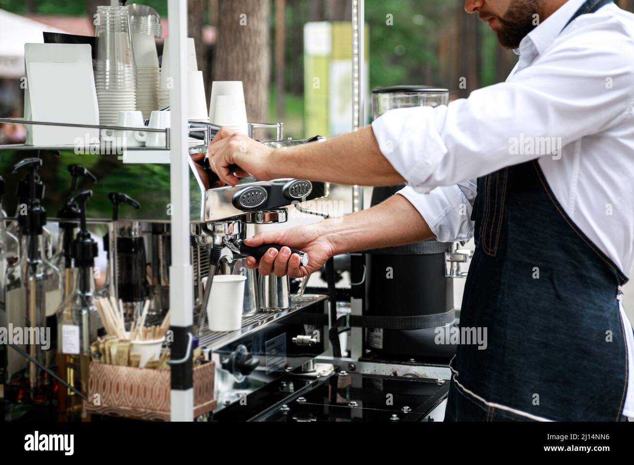 Barista making coffee using professional espresso machine Stock Photo Alamy