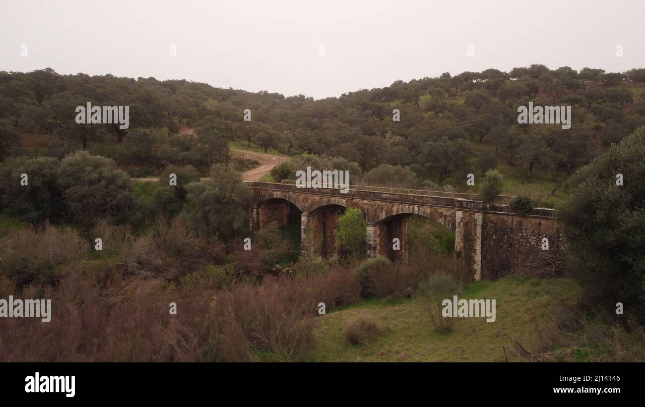 Distant view of the old and abandoned bridge in Huelva, Rosal de la Frontera, Spain Stock Photo