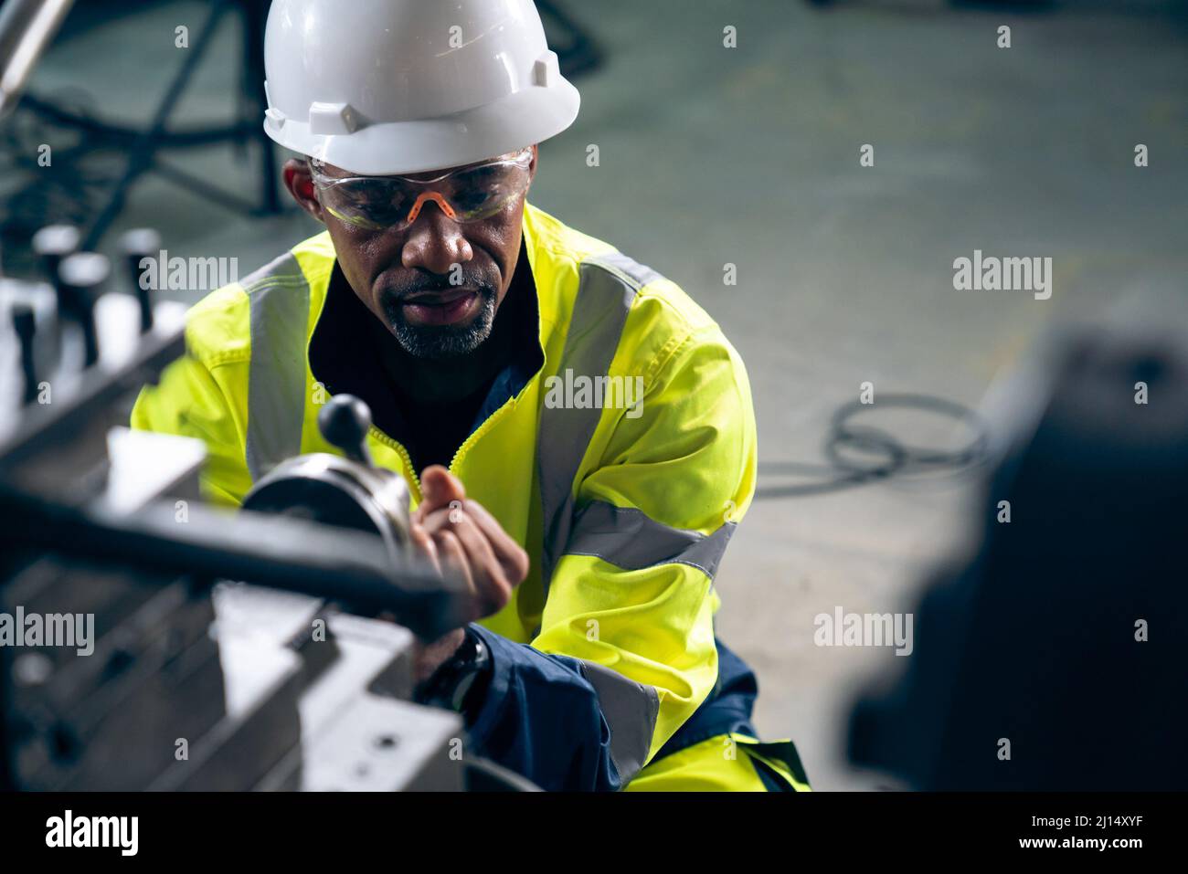 Factory worker or engineer do machine job in adept manufacturing