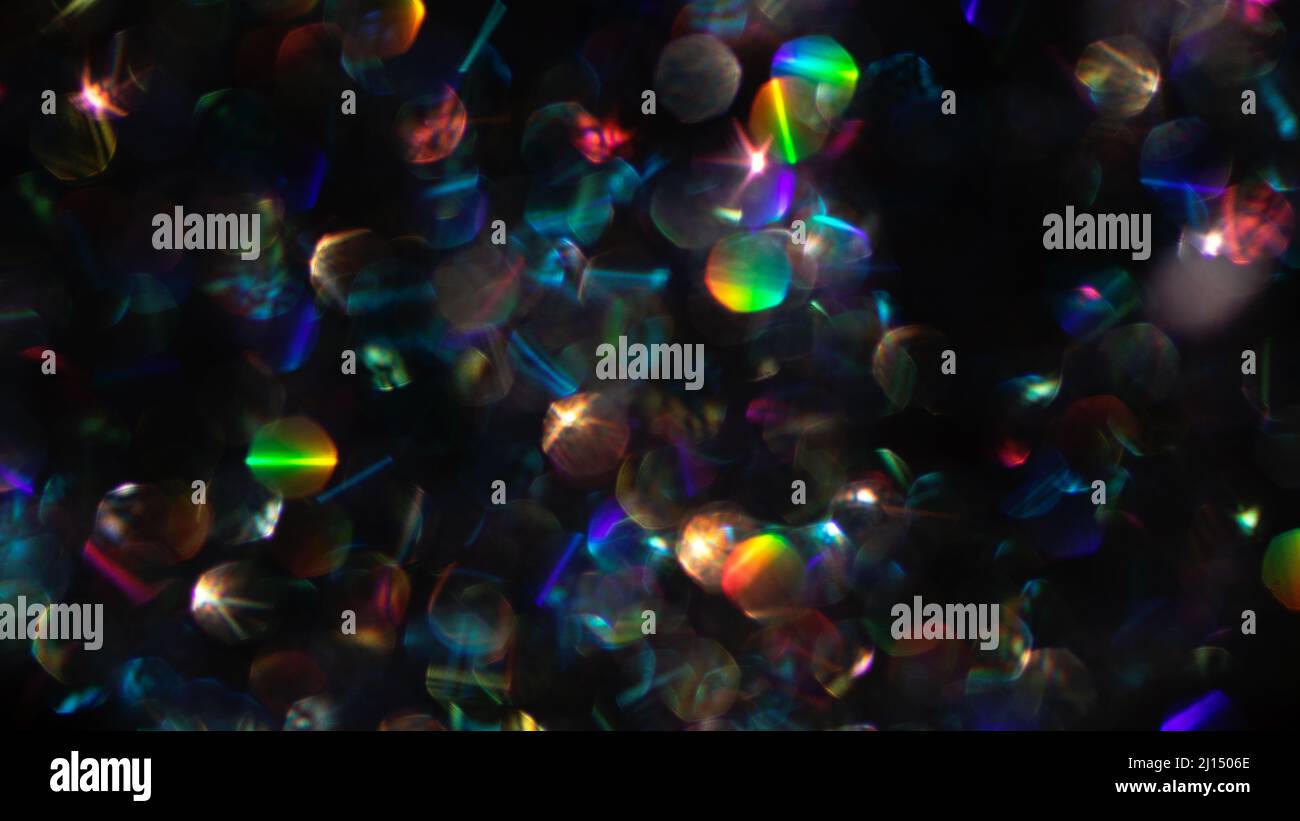 Abstract defocused black background with shining glitter.Good as ...
