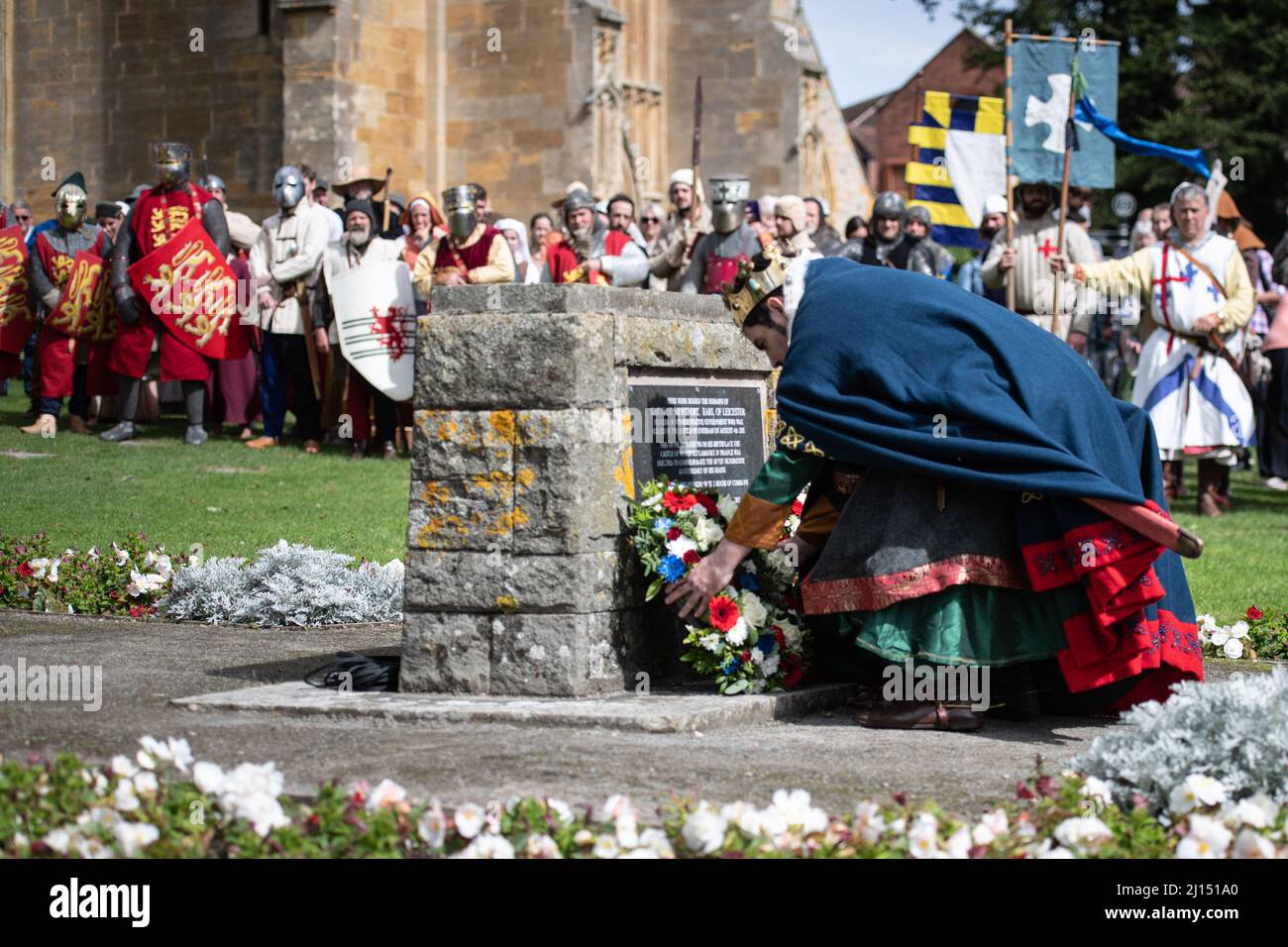 Evesham, Worcestershire, UK. 7th August, 2021. Pictured: Re-enactors pay their respects as a wreath is laid at Simon de Montford's memorial stone in A Stock Photo