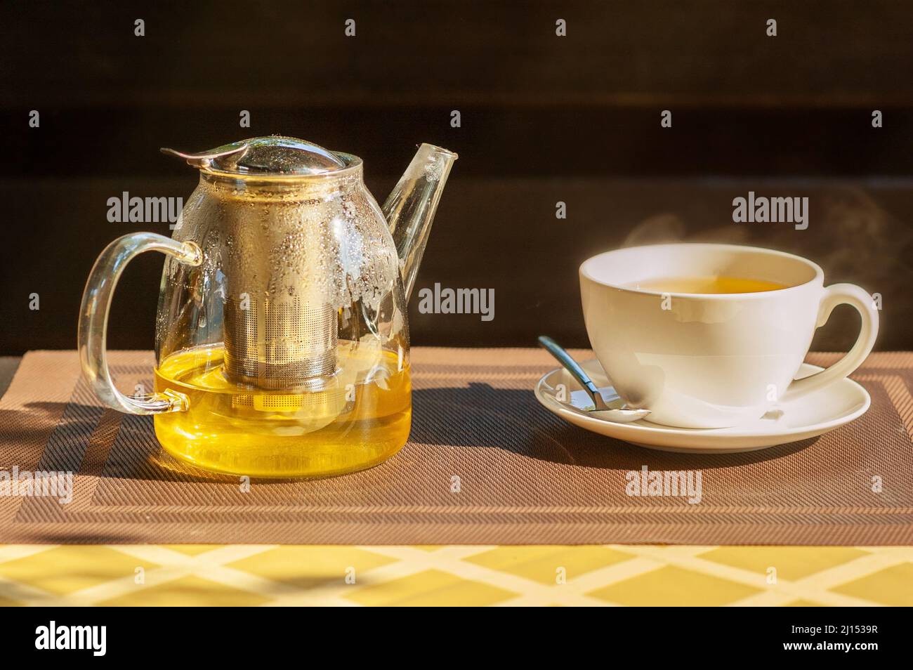 Green tea in a teapot on the table. Tea in a white cup Stock Photo Alamy