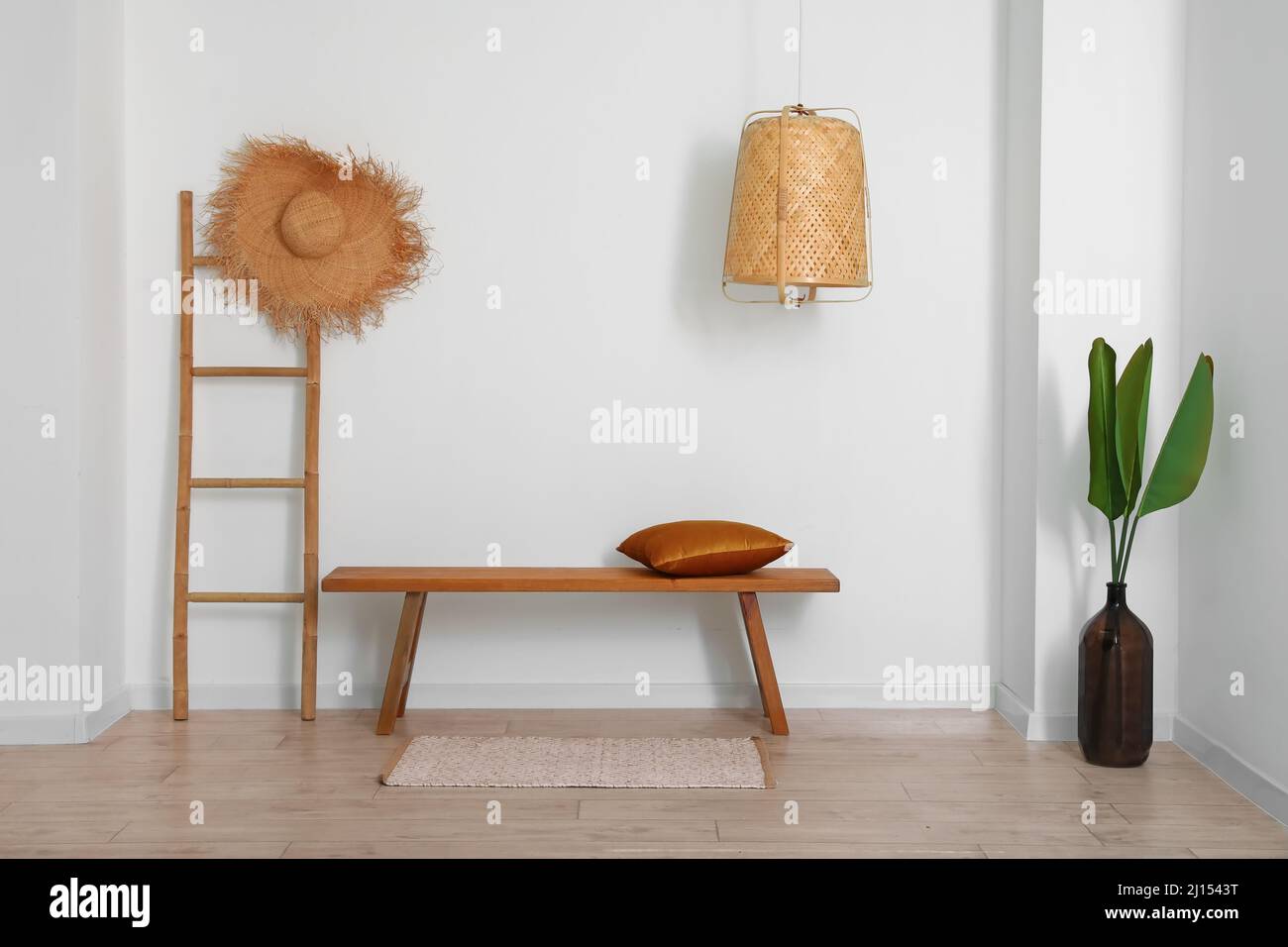 Interior of light room with wooden bench and ladder Stock Photo - Alamy