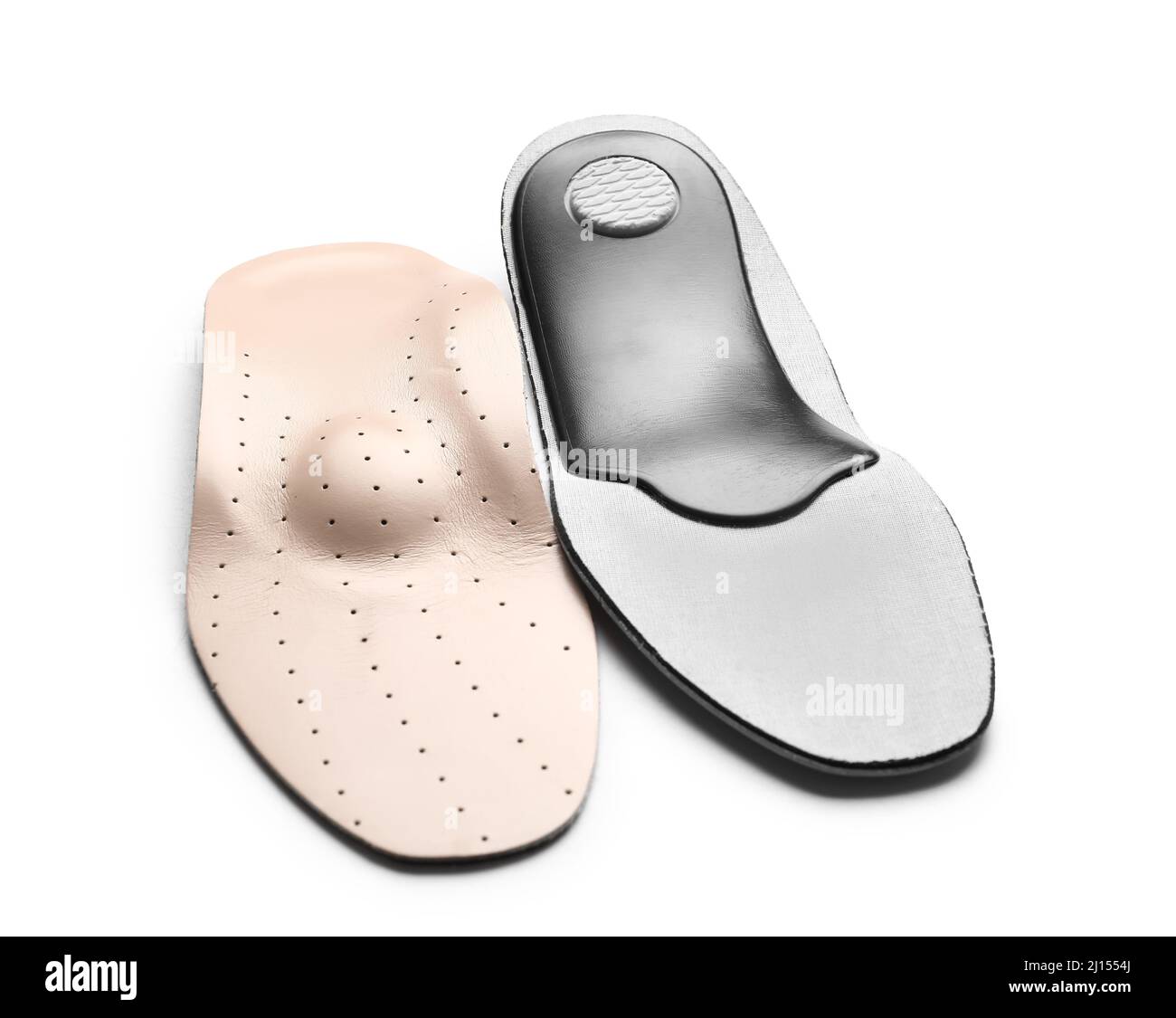 Beige orthopedic insoles on white background Stock Photo - Alamy