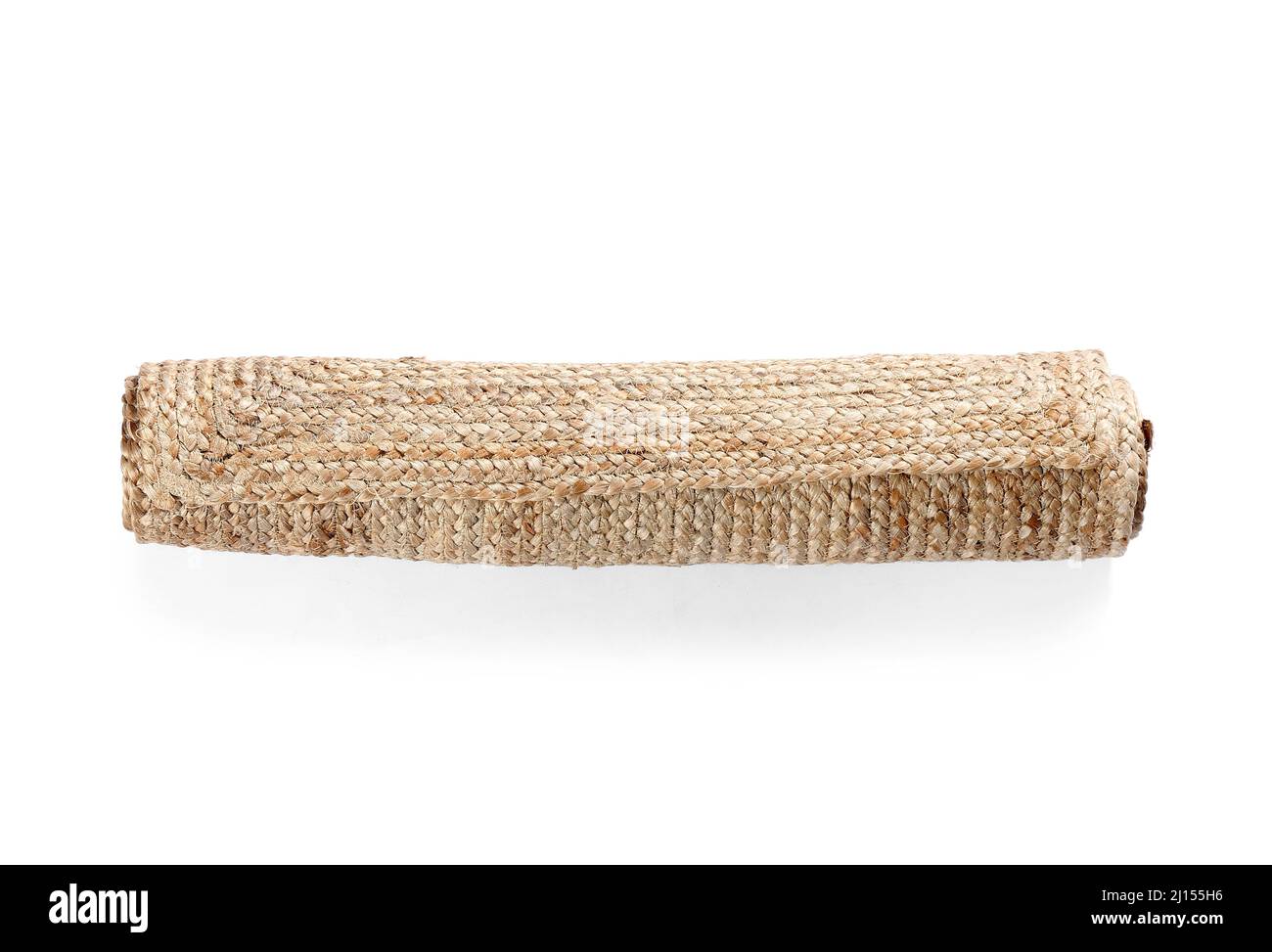 Roll of wicker carpet on white background Stock Photo - Alamy