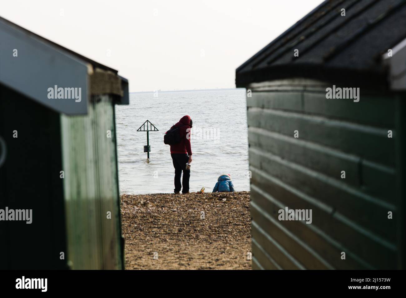Fatherhood Concept - Rear view of a father and child at the seaside. Stock Photo
