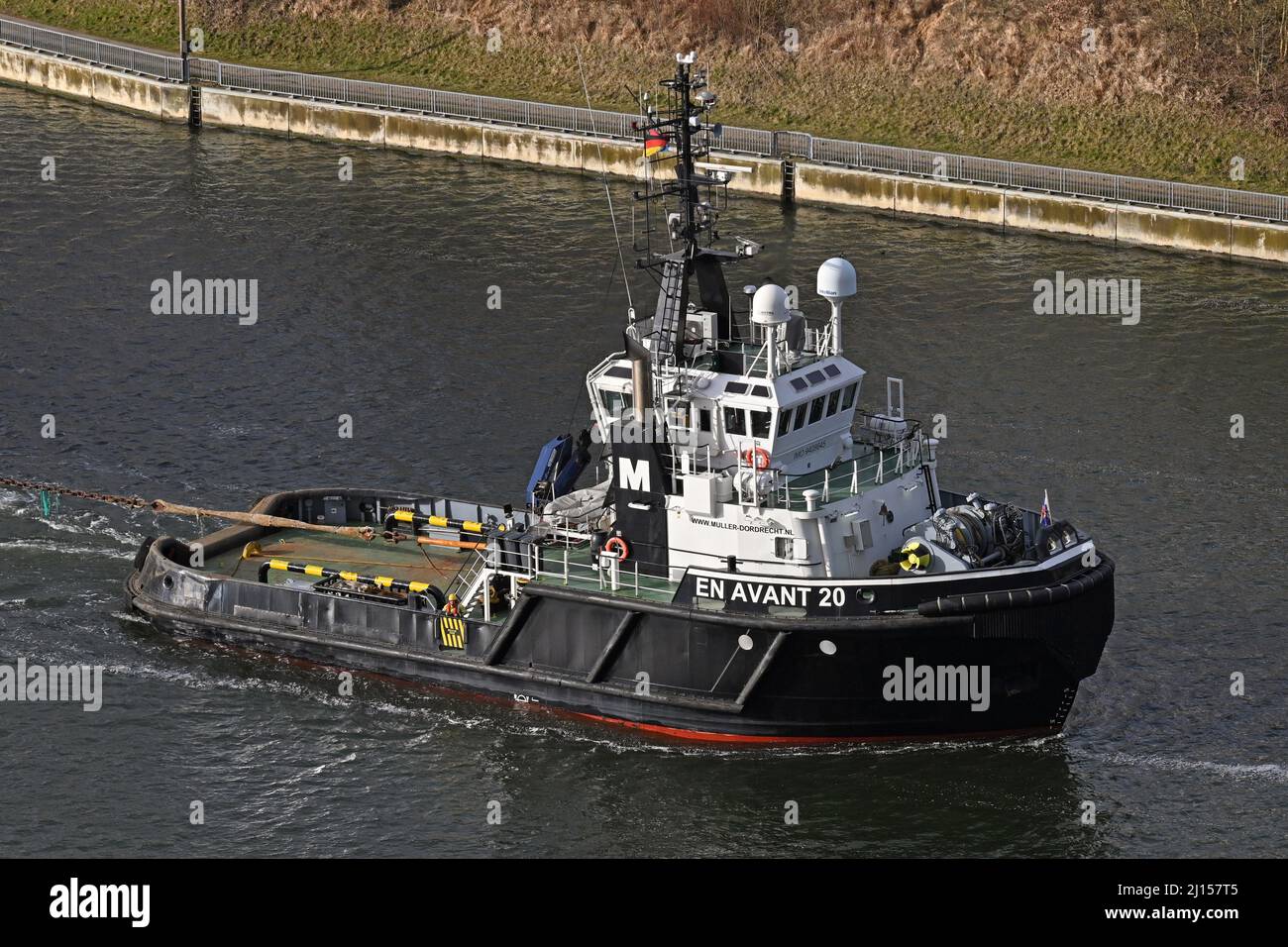 Tug and tow EN AVANT 20 with the worlds biggest monopiles passing the Kiel Canal bound for Roenne Stock Photo