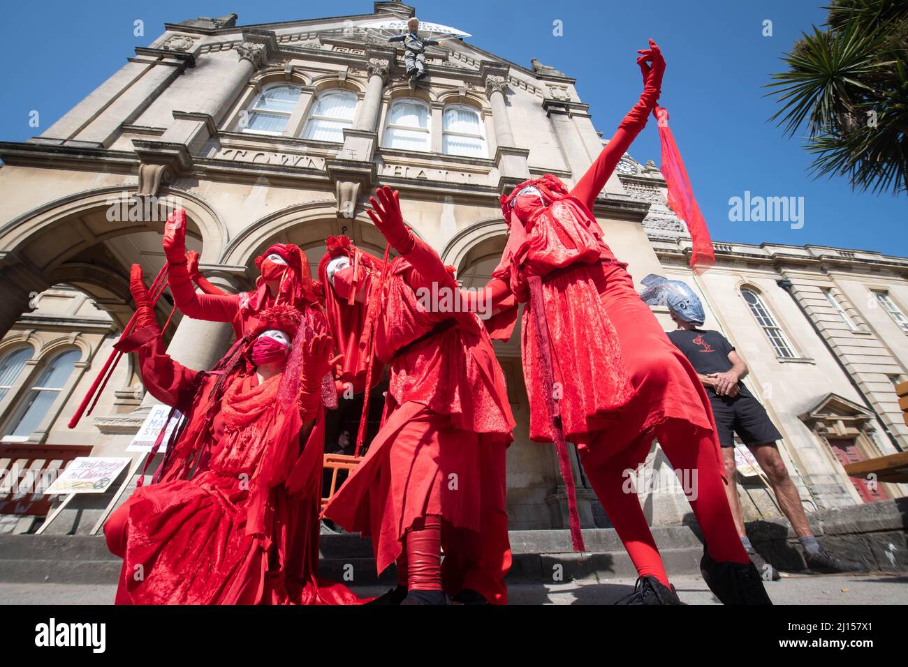 Weston-super-Mare, North Somerset, UK. 20th July 2021. Pictured: The Red Rebel performance protesters.  Regarded by some environmentalists as the most Stock Photo