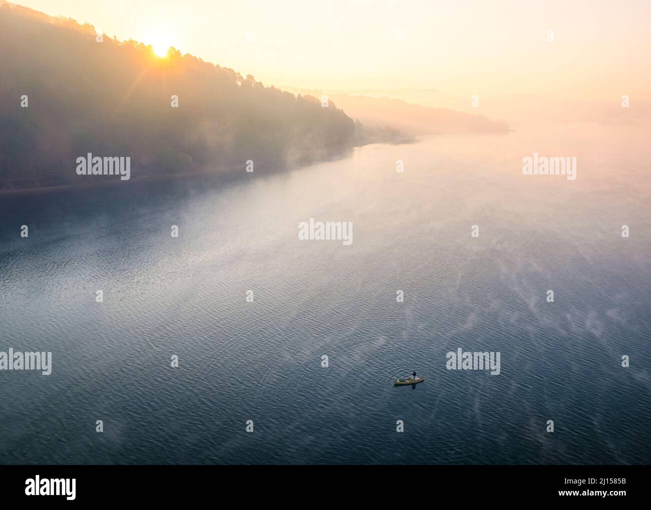 A lone fisherman at sunrise on Lake Zirahuen in Michoacan, Mexico. Stock Photo