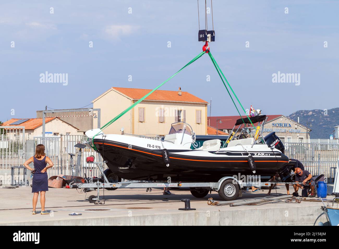 Propriano, France - August 22, 2018: Preparing to launch the boat, Propriano harbor, Corsica Stock Photo