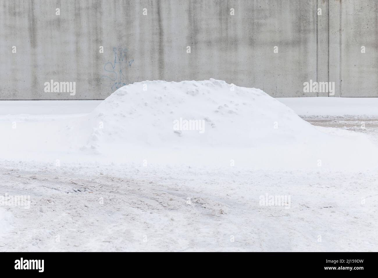 A pile of cleared snow in a car park in Longueuil, Quebec, Canada Stock