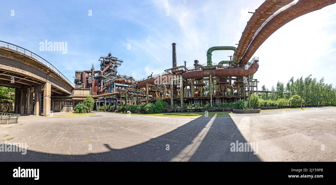 Disused blast furnace plant in Duisburg, Ruhr area district industry ruins with old bridge Stock Photo