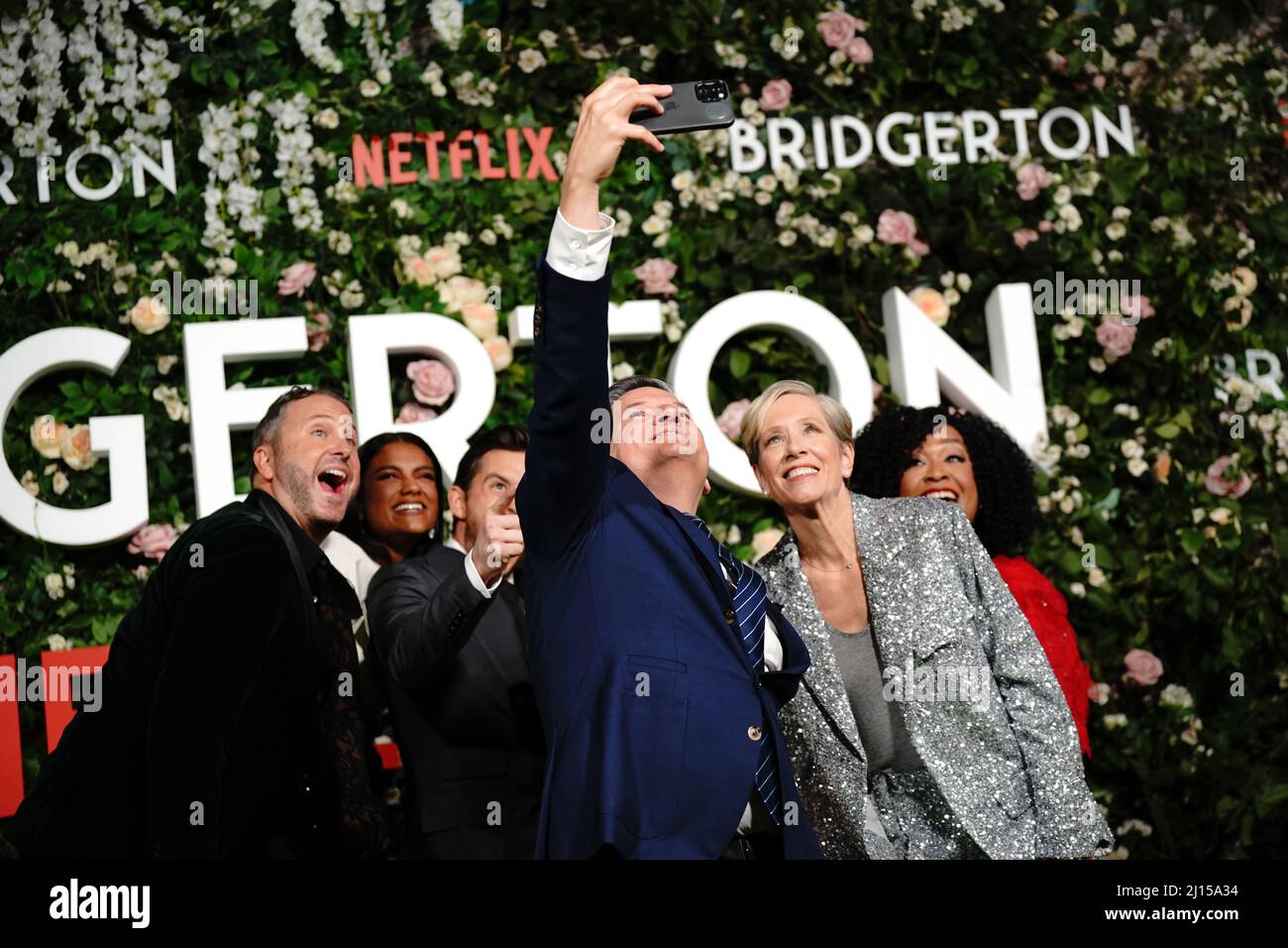 The cast and crew of Bridgerton (left to right) Showrunner Chris Van Dusen, Simone Ashley, Jonathan Bailey, Charithra Chandran, Executive Producer Betsy Beers and Executive Producer and Shonda Rhimes pose for a selfie ahead of the world premier of series two of the Netflix period drama Bridgerton, at Tate Modern, London. Picture date: Tuesday March 22, 2022. Stock Photo