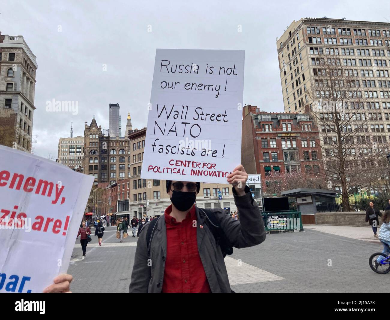 A small band of pro-Russian activists march around Union Square Park in New York showing support for Russia on Sunday, March 20, 2022. (© Frances M. Roberts) Stock Photo