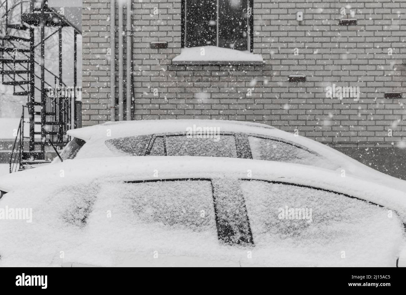 Parked cars during a winter snowstorm, in Longueuil, Quebec, Canada Stock Photo