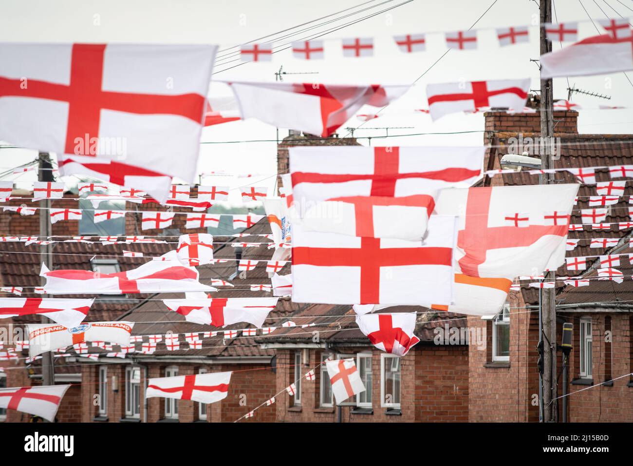 Torrington Avenue, Knowle West, Bristol, UK. 17th June 2021. A housing estate street in Bristol has been covered in flags and bunting ahead of England Stock Photo