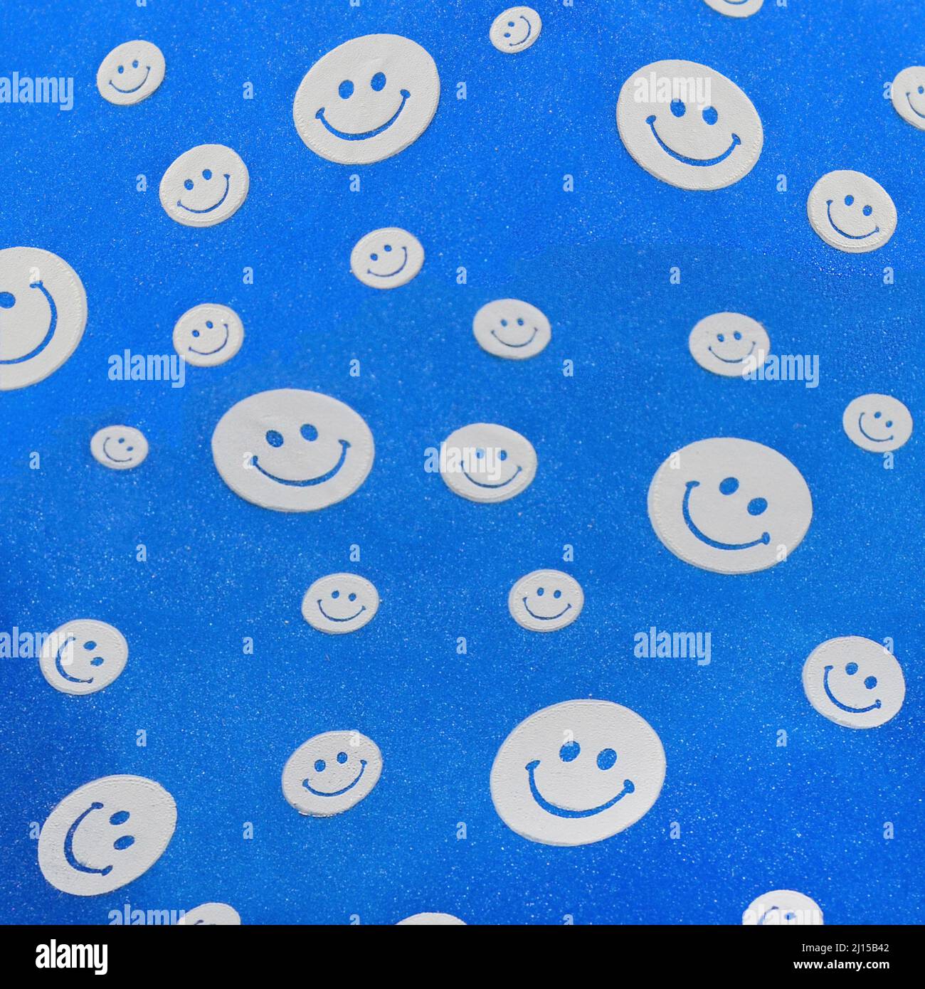 Photo background with happy smileys colorful. Smiling emoticons on blue background Stock Photo