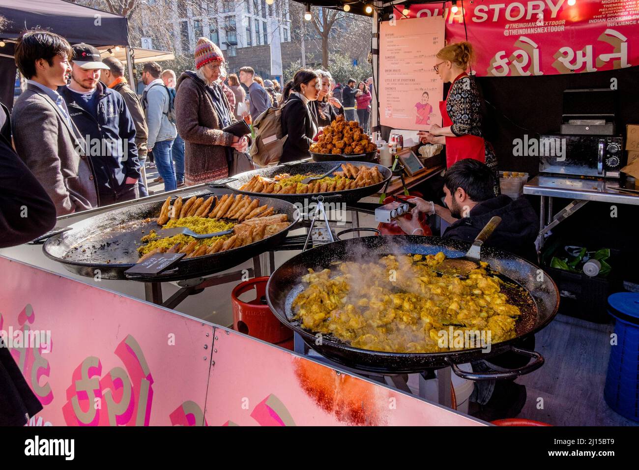Customers at an Indian food stall at Southbank Centre Food Market
