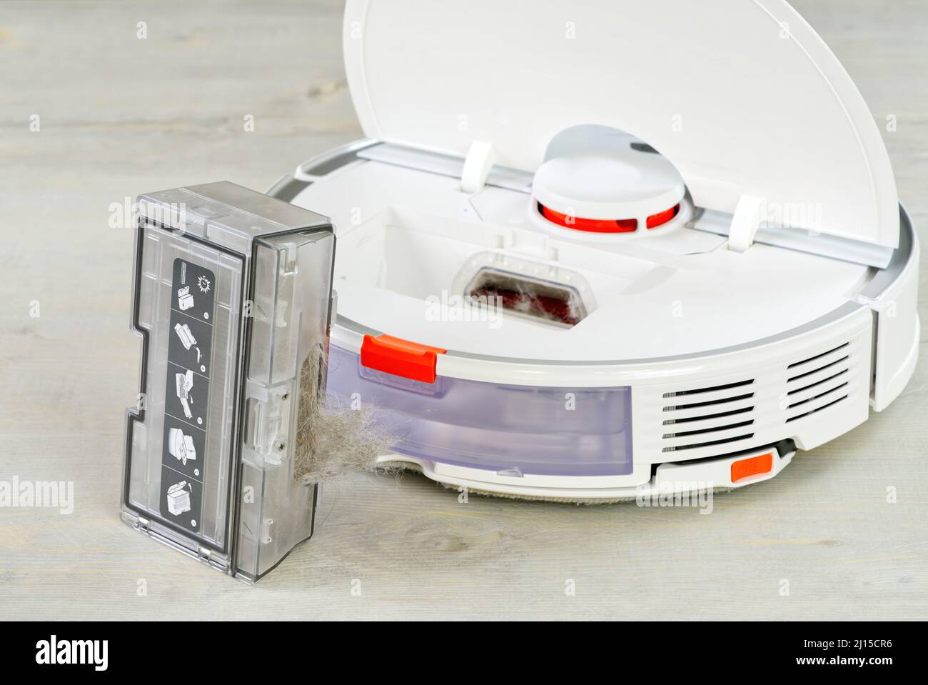 robot vacuum cleaner water tank removed and the filter lid is opened to clean. Smart cleaning