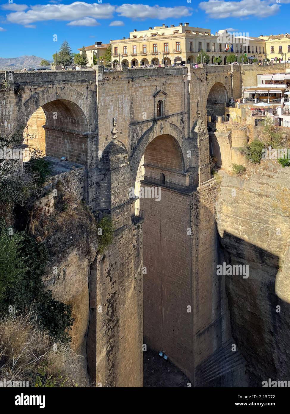 City of Ronda, Spain, and view of the New Bridge, or Puente Nuevo in Spanish. Ronda is one of the picturesque and popular White Villages. Stock Photo