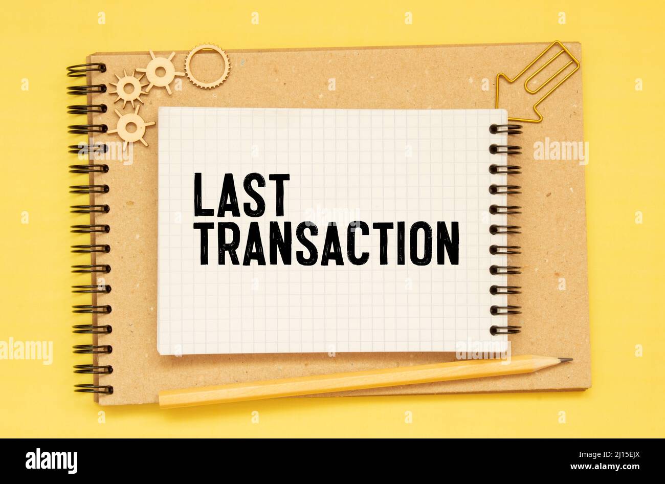 Closeup on businessman holding a card with text LAST TRANSACTION ...