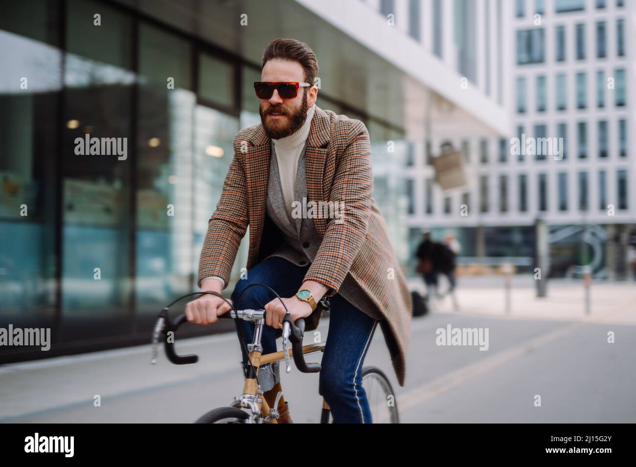 Businessman going to work on bike. Eco friendly transport Stock Photo
