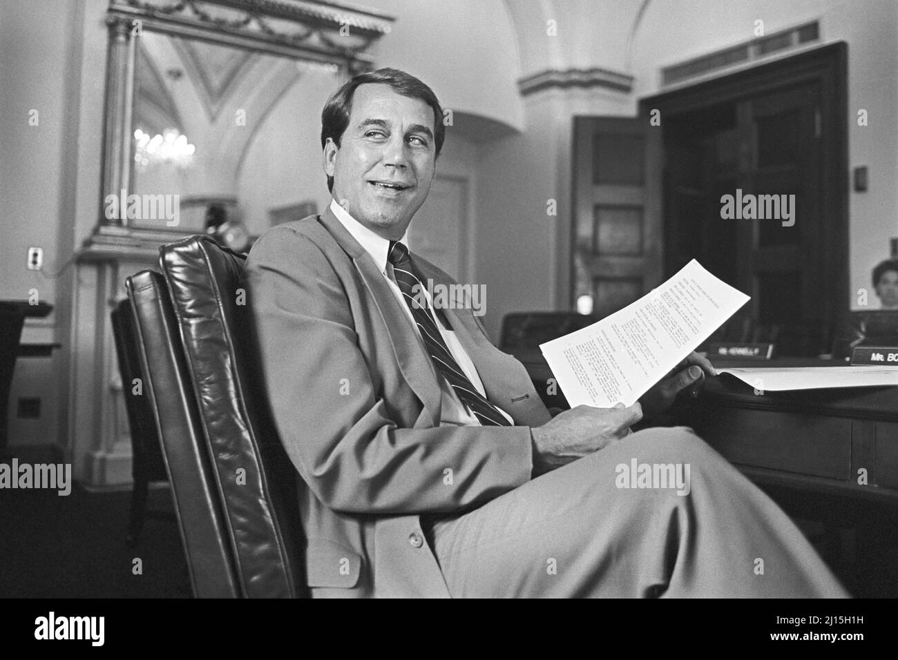 U.S. Congressman from Ohio John Boehner, seated at desk, holding a paper, Washington, D.C., USA, Laura Patterson, Roll Call Photograph Collection, May 1993 Stock Photo