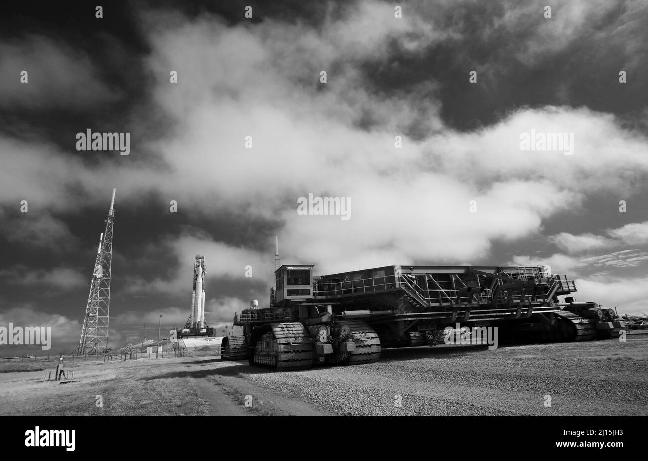 In this black and white infrared image, Crawler-Transporter 2 is seen outside the perimeter fence of Launch Complex 39B after the arrival of NASA’s Space Launch System (SLS) rocket with the Orion spacecraft aboard is seen atop a mobile launcher, Friday, March 18, 2022, at NASA’s Kennedy Space Center in Florida. Ahead of NASA’s Artemis I flight test, the fully stacked and integrated SLS rocket and Orion spacecraft will undergo a wet dress rehearsal at Launch Complex 39B to verify systems and practice countdown procedures for the first launch. Photo Credit: (NASA/Joel Kowsky) Stock Photo
