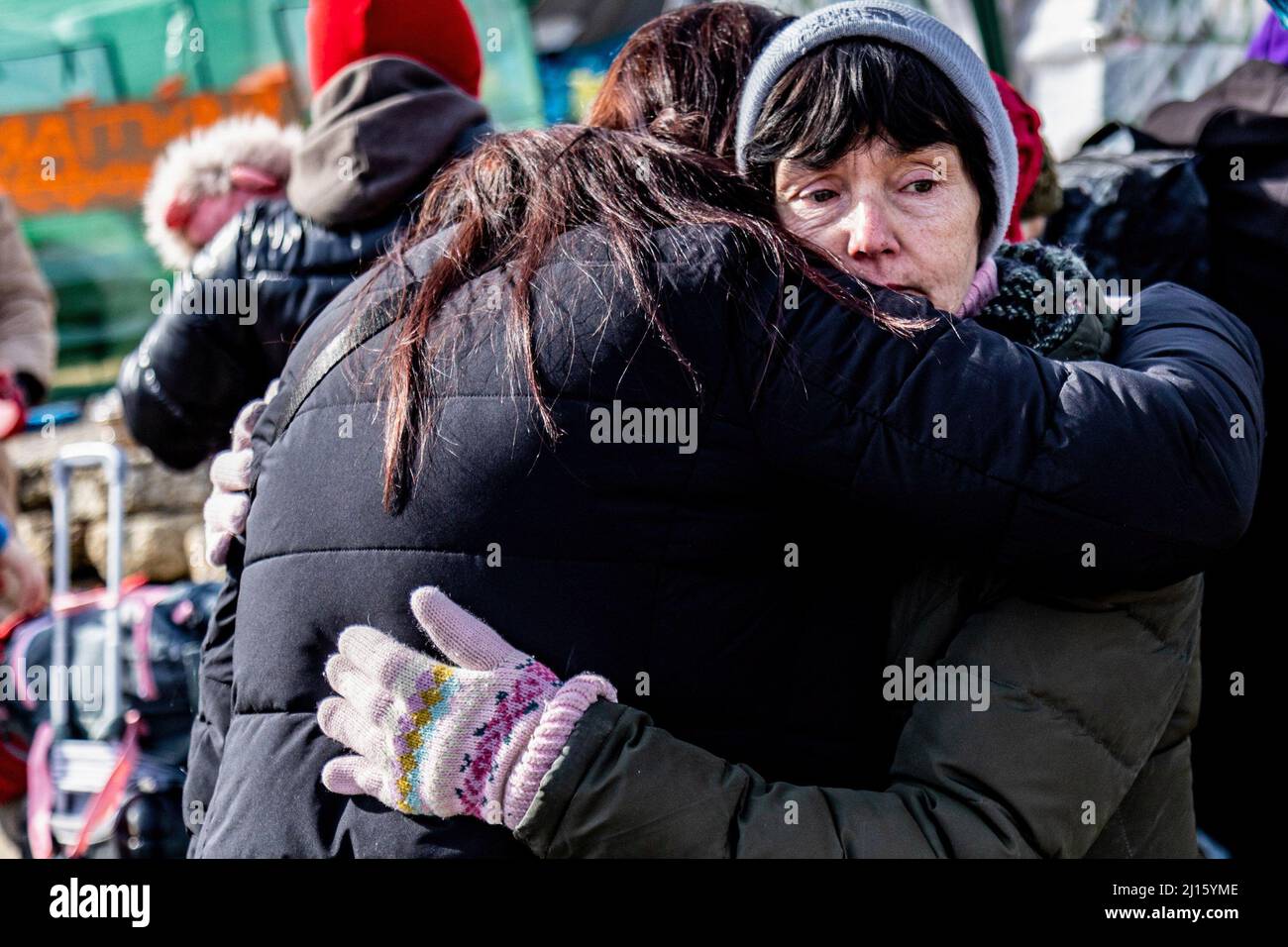 Medyka, Poland. 12th Mar, 2022. Ukrainian refugees hug after crossing into Medyka, Poland from Ukraine. Since the war started, more than 3 million people have fled the country. Credit: SOPA Images Limited/Alamy Live News Stock Photo