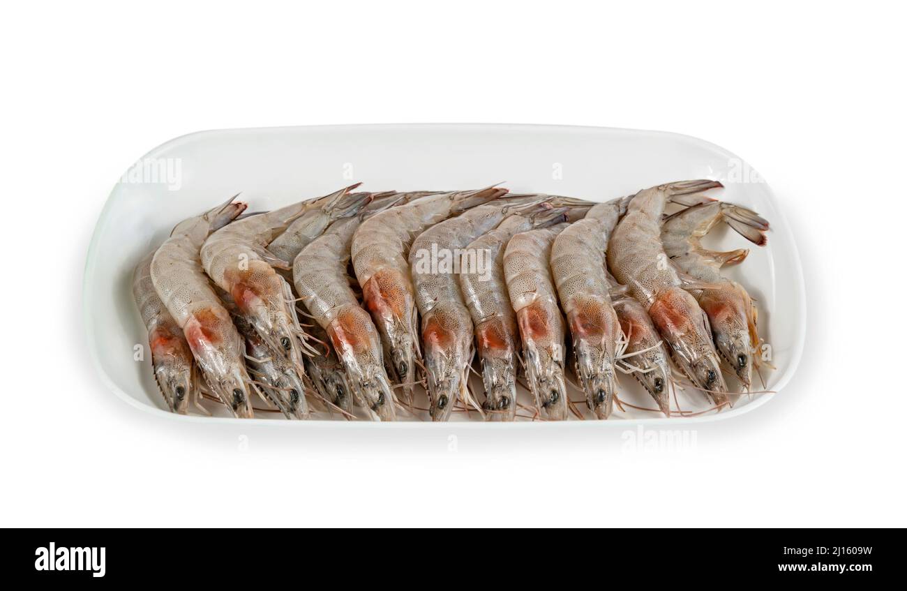 raw prawns on plate over white background Stock Photo