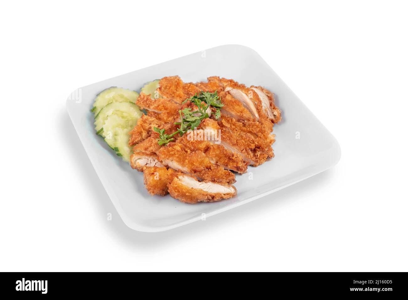 deep fried chicken with garlic on dish over white background Stock Photo